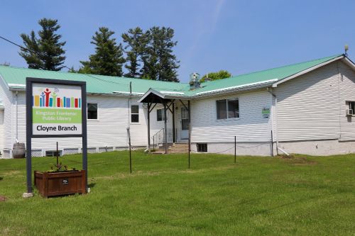 White building with green lawn and Cloyne Branch white sign