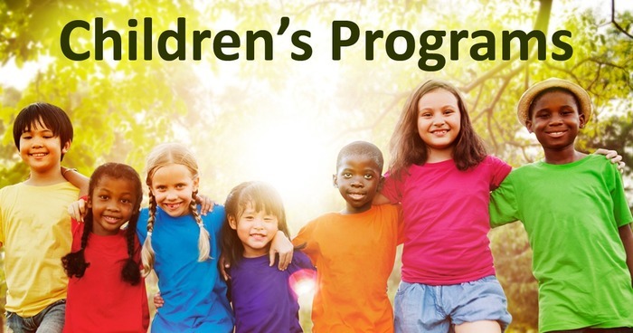 A group of children in bright shirts stand arm in arm. Text reads Children's Programs.