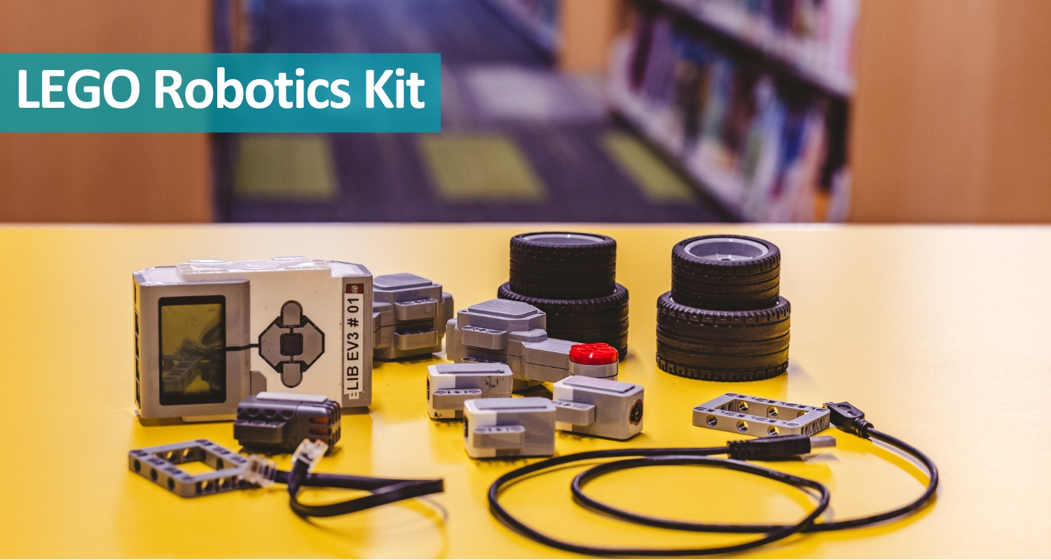 A Lego robotics kit displayed on a yellow table. The text reads Lego Robotics Kits