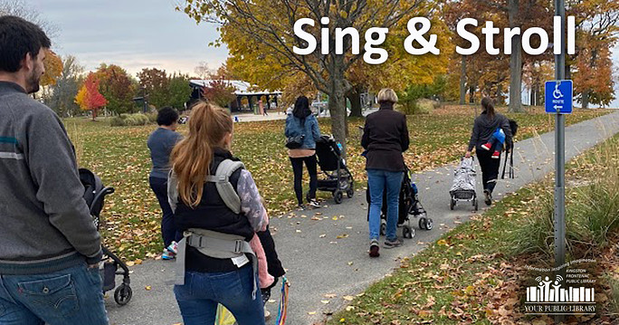 Image of a group of parents pushing strollers along a park path. The text reads Sing & Stroll.